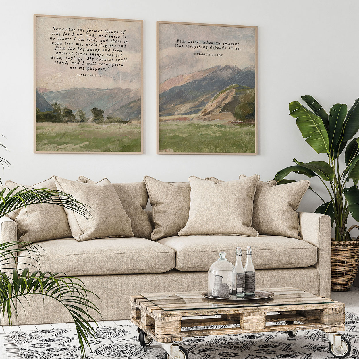 Two landscape art prints with Scripture framed above a linen sofa